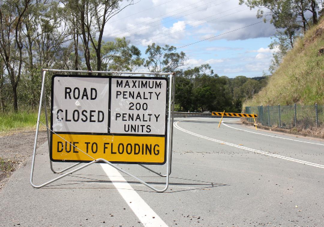 Road Closure Due to Flooding sign on a Brisbane road