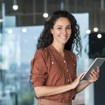 Clinical informatics student holds a tablet