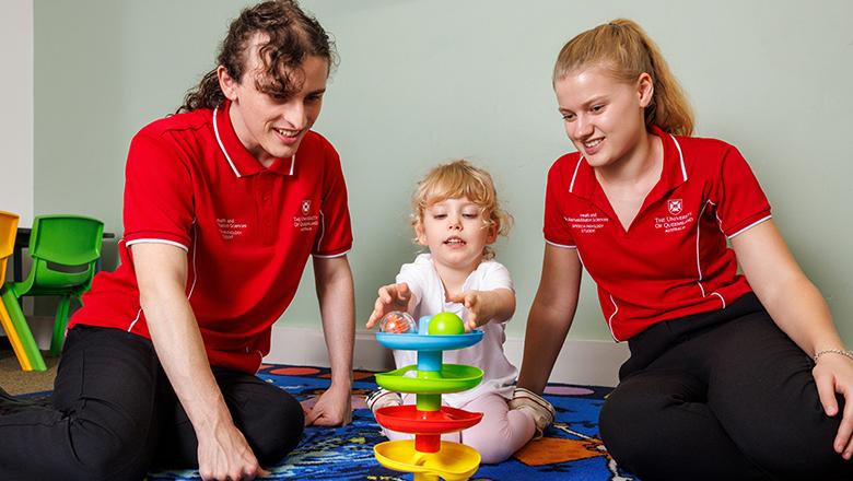UQ speech pathology students work with a child