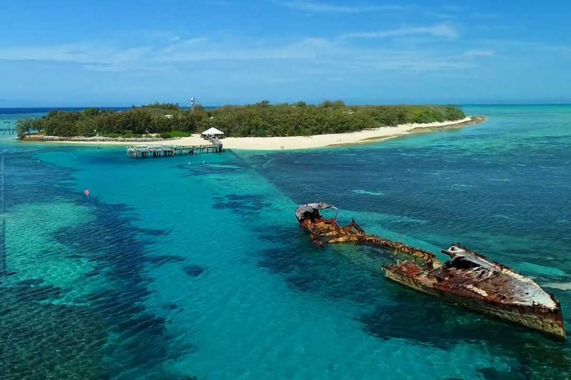 Aerial image of a shipwreck over the reef at Heron Island research station